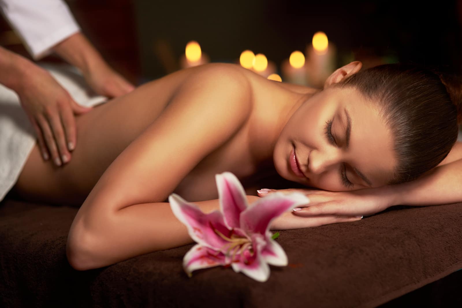 Woman enjoying a professional home massage session in Dubai Woman enjoying a professional home massage session in Dubai
